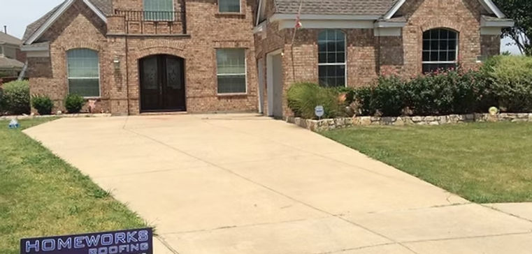 Modern residential roof replacement completed by Homeworks Roofing on a two-story suburban home