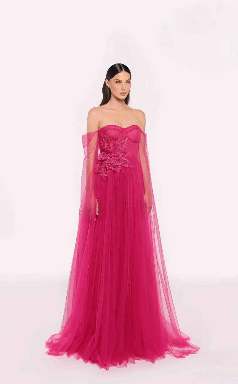Make a bold statement in this fuchsia pink strapless gown featuring a structured corset bodice and a voluminous tulle skirt.