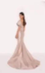 Deep pink off-shoulder mermaid gown with asymmetric neckline, structured draping, and flared hem.