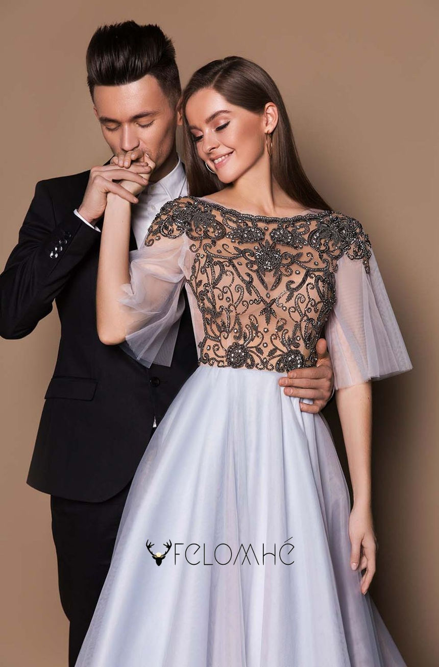 Regal lavender and silver gown with intricate beading and illusion neckline, ideal for luxury soirées and formal occasions.