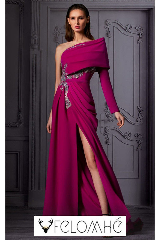 Fuchsia one-shoulder evening gown with draped fabric, crystal embellishments, and a high slit.