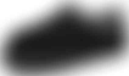 Black comfy slipper shoes with white detailing