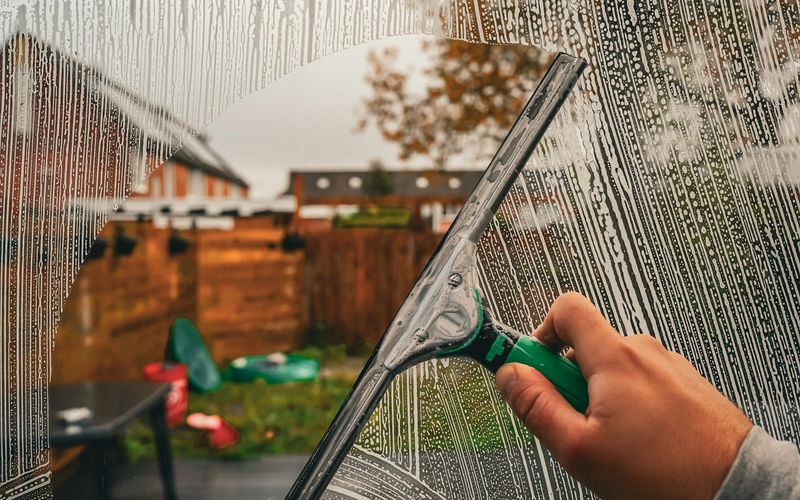 Squeegee finishing a clean pane of glass