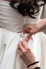Bride smiling during getting ready moments before her Niagara vineyard wedding.