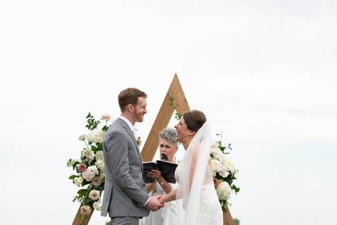 Vineyard wedding ceremony in Niagara-on-the-Lake photographed by Niagara wedding photographer