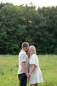 Romantic countryside engagement photos with horses before a Niagara wedding.