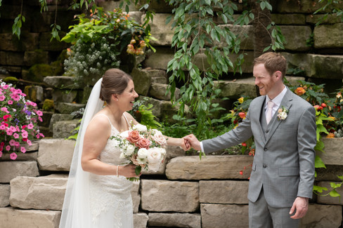 Emotional embrace captured by Niagara wedding photographer at winery venue