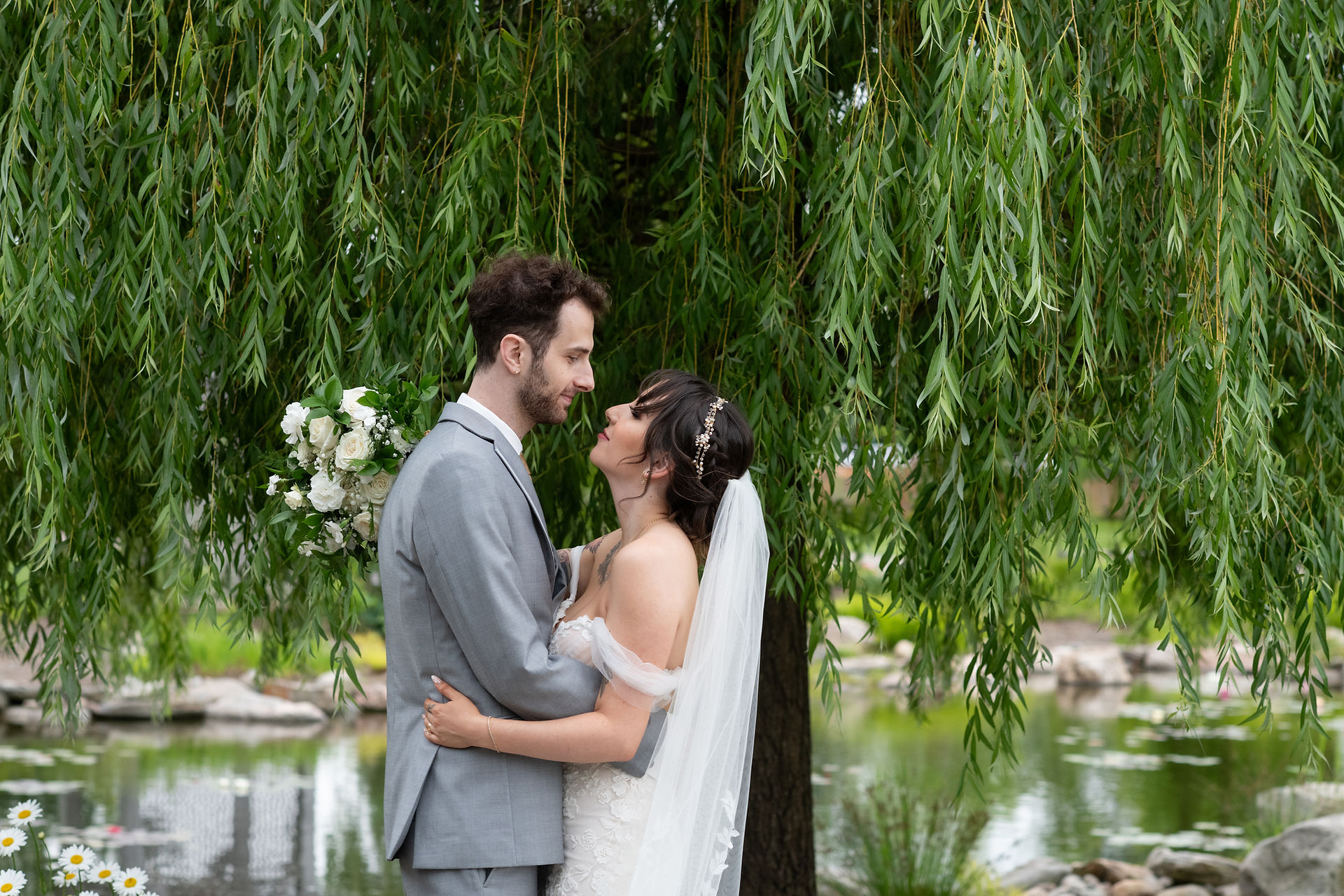 Romantic bride and groom portrait at Pillar and Post rose garden by Niagara wedding photographer