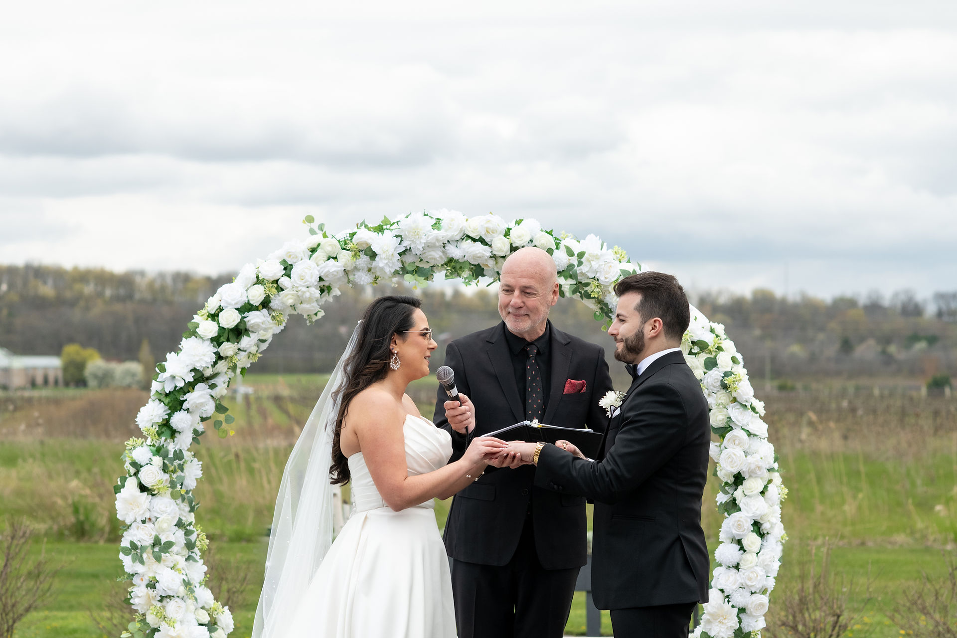 Elegant outdoor wedding ceremony at Queenston Mile Vineyard in Niagara-on-the-Lake.