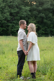 Romantic countryside engagement photos with horses before a Niagara wedding.