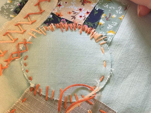 fabric embroidered with coloured threads