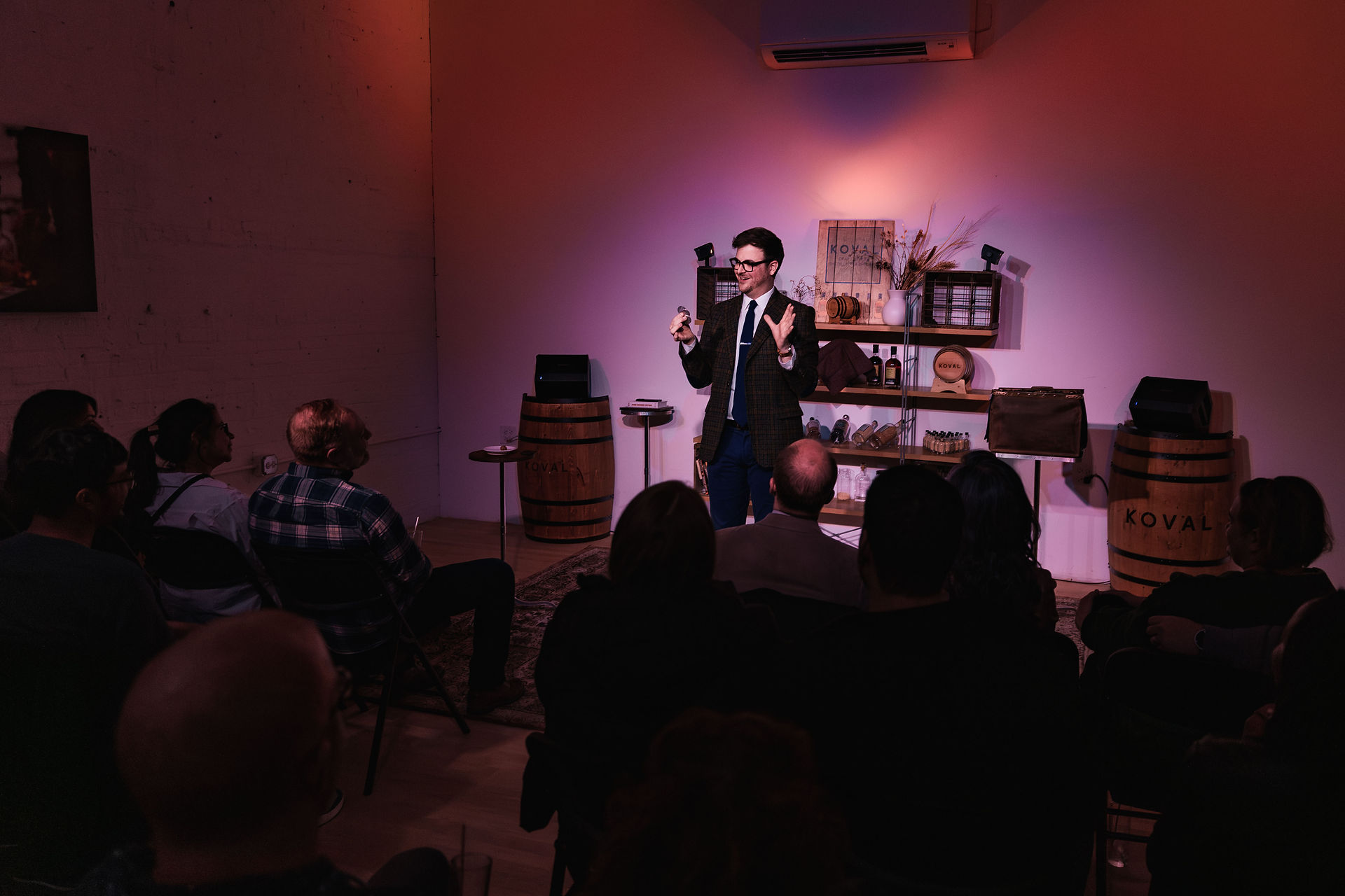 Chicago Magician Ryan Plunkett performing Old Fashioned Magic at the Koval Distillery photographed by James Murphy for Trainman Photography