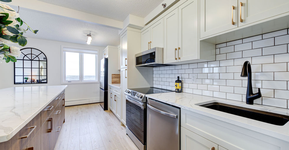 Modern kitchen with dishwasher, microwave, stove, fridge. This condo is a short-term furnished rental, which is also known as an airbnb. This condo is professionally managed by Squire Hospitality Inc., which is a division of Squire Property Management Inc. in Saskatoon, Saskatchewan.