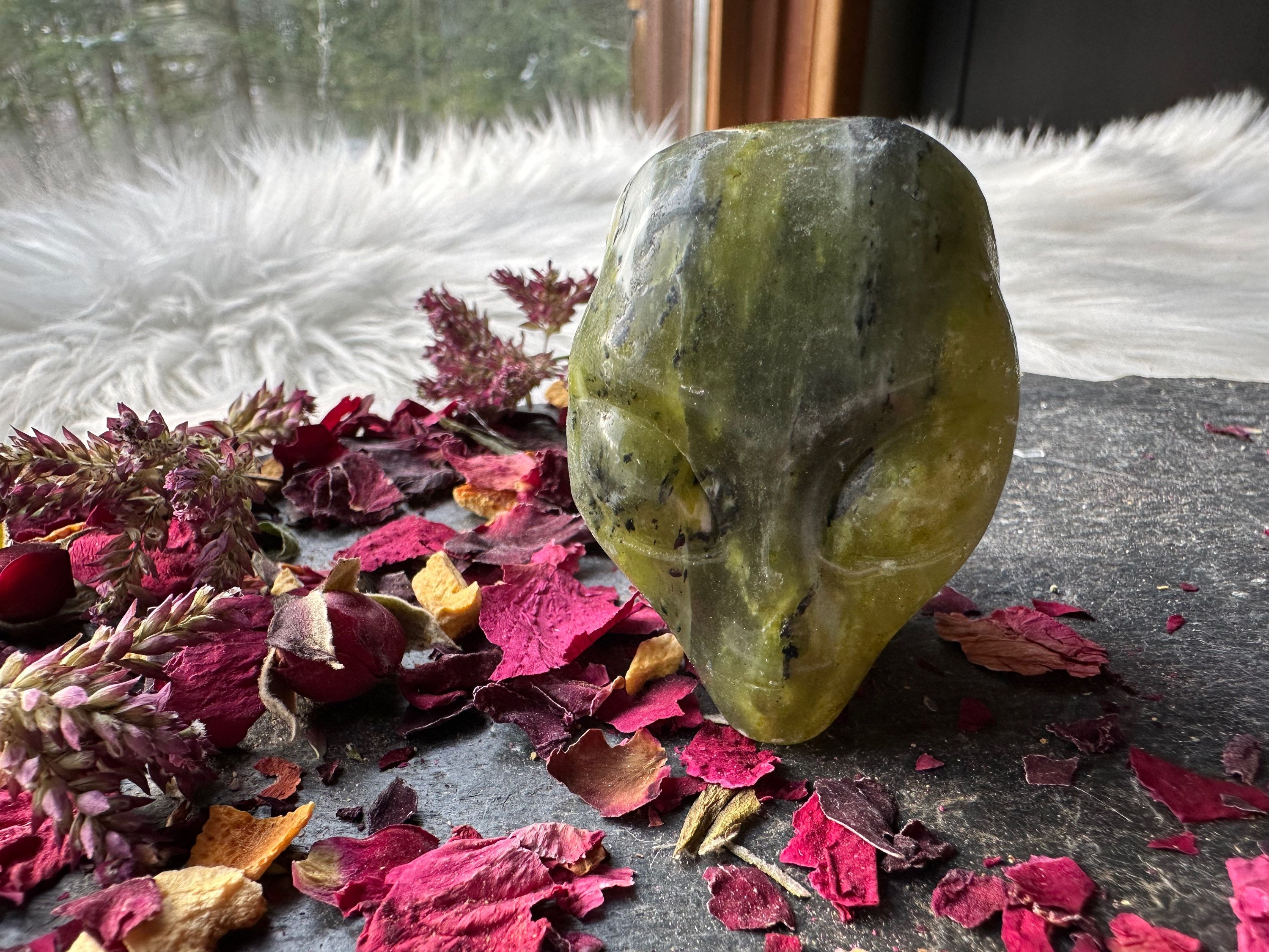 Serpentine starbeing carved crystal  2 inch size 