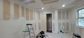Room undergoing drywall installation