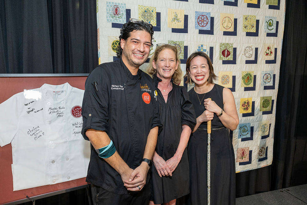 Members of the gala's chef committee present at the event pose for a photo on stage.