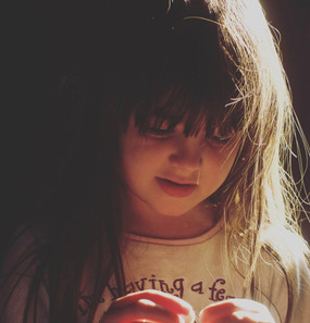 little girl with hair caught in sunlight