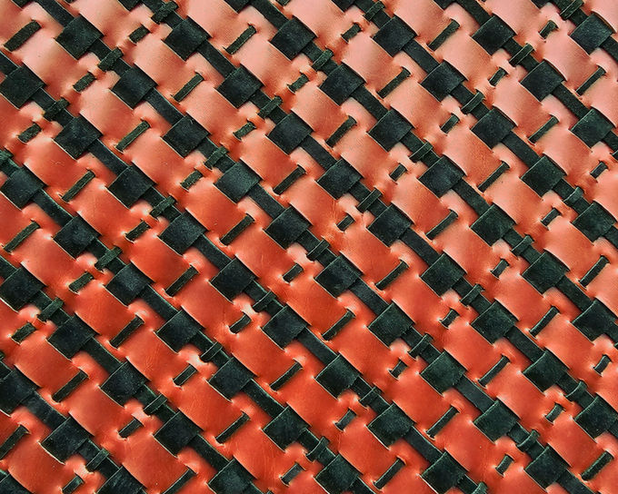 Hand-woven cowhide and suede textile designed by Entrelazado