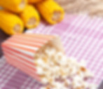 front-view-fresh-popcorn-with-yellow-corns-dark-surface-snack-popcorn-corn.jpg