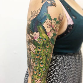 peacock half sleeve beautiful and elegant feminine bold colour with flowers original artwork custom design colour tattoo colourful experienced tattoo artist cover up tattoo fix up created by Derek Lewis at Lewis Family Tattoo Company using Better Butter Care tattoo glide and aftercare Flame Wise Ink Heartless Ink Hartless Ink Chronic Ink Tattoo People Tattoo Junction New Tribe Tattoo Toronto tattoo studio tattoo shop Dundas West Roncesvalles Ave