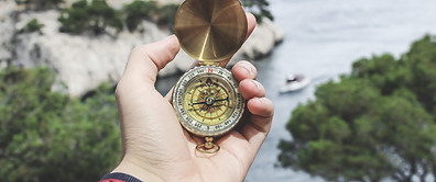person-holding-compass-691637.jpg