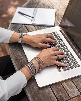 person%20typing%20on%20MacBook%20Pro%20on%20brown%20wooden%20table%20during%20daytime%20photo_edited