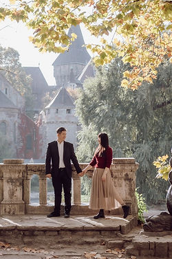 Romantic couple photoshoot at Vajdahunyad Castle during sunset in Budapest.