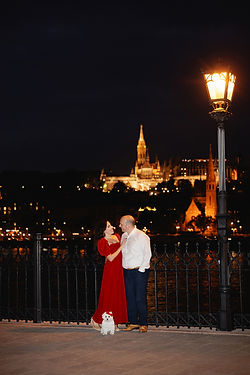 Couple night photoshoot in Budapest with city lights and romantic travel atmosphere