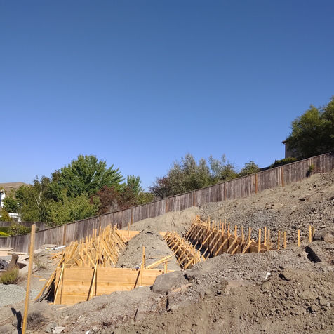 Seat wall, retaining wall, bocce court, concrete forms, excavation 