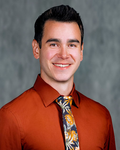 Micaiah_Headshot_light gray.jpg