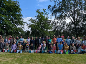 More than 60 people gathering in Calthorpe Interfaith Community Orchard in Calthorpe Park, Balsall Heath, 14th June 2026, for another beautiful community picnic and orchard care session - bringing people together across faiths and cultures.