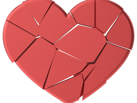Paper heart torn apart and put back together.