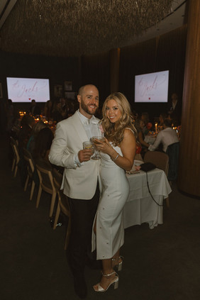 cute picture of the newlyweds looking at the camera