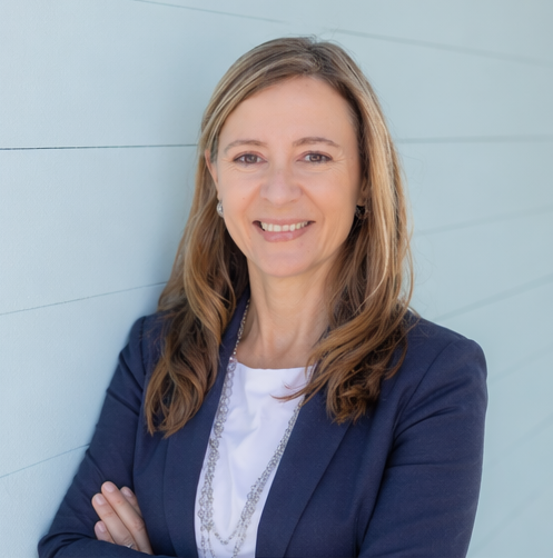 Headshot navy coat.PNG