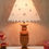 Thumbnail: Table Lamp in trophy style made from premium wood hand carved pattern