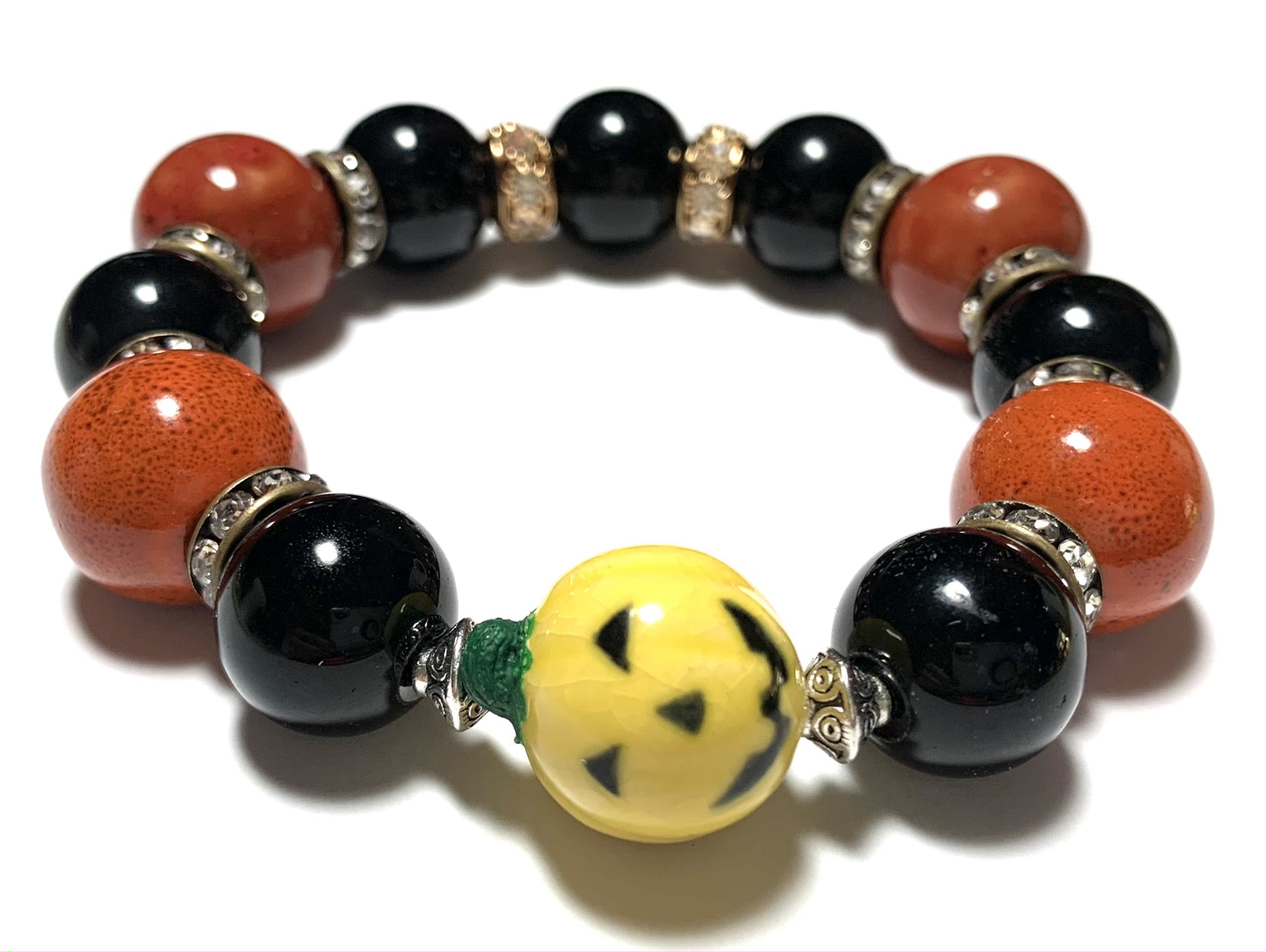 Chunky large ceramic burnt orange and black beads with yellow pumpkin