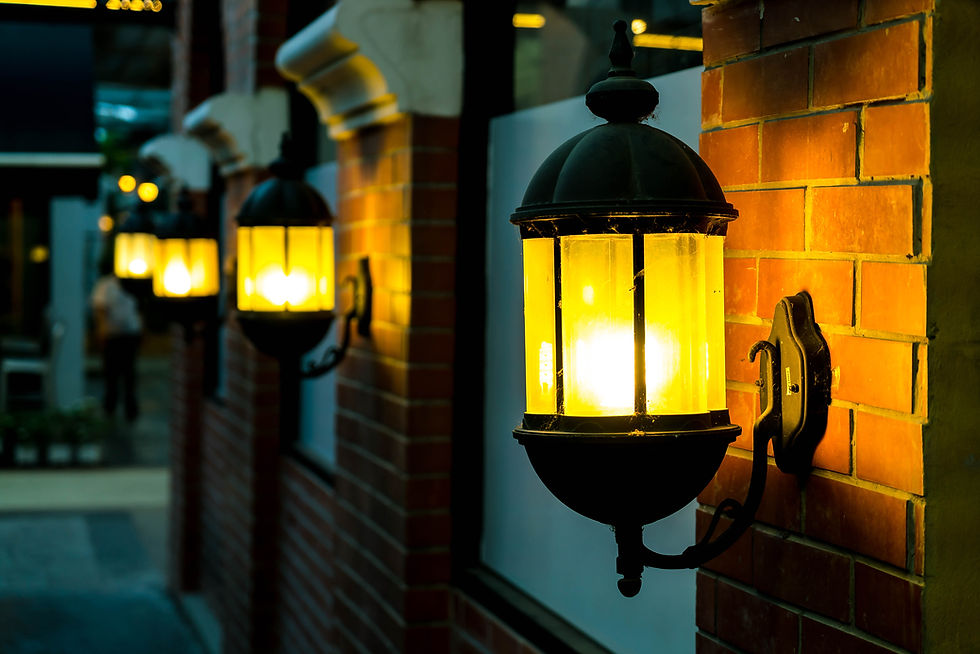 lamp-against-red-brick-wall-night.jpg