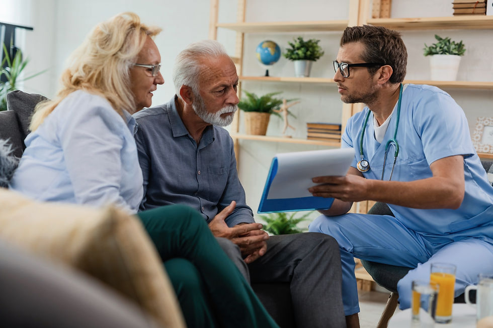 general-practitioner-showing-senior-couple-medical-documents-while-being-home-visit.jpg