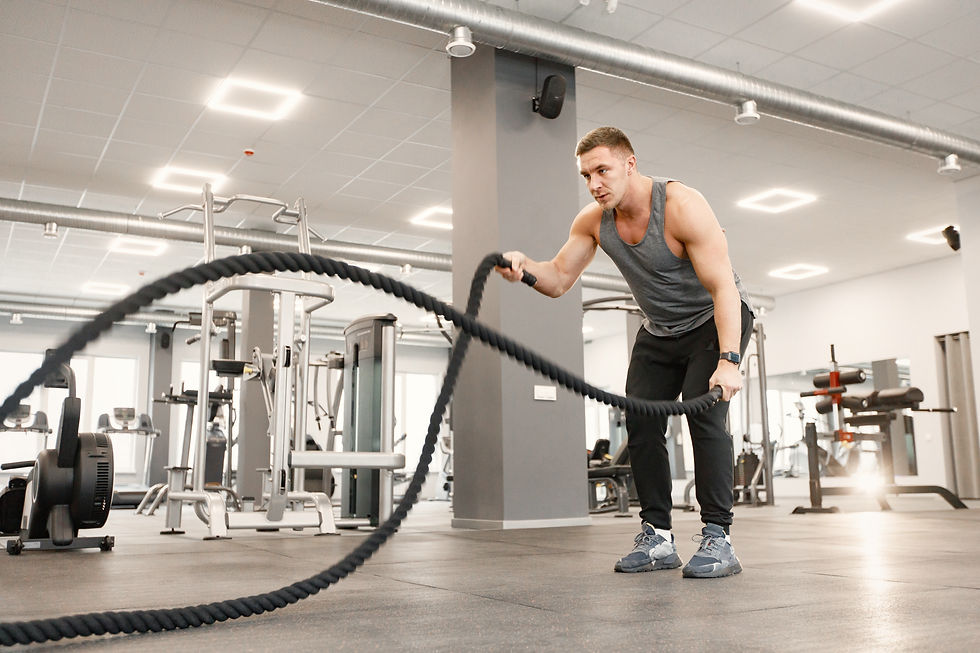 young-man-sportswear-doing-excercisses-with-special-rope-gym.jpg