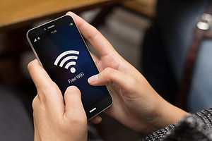 girl using a digital generated phone with free wifi on the screen. All screen graphics are