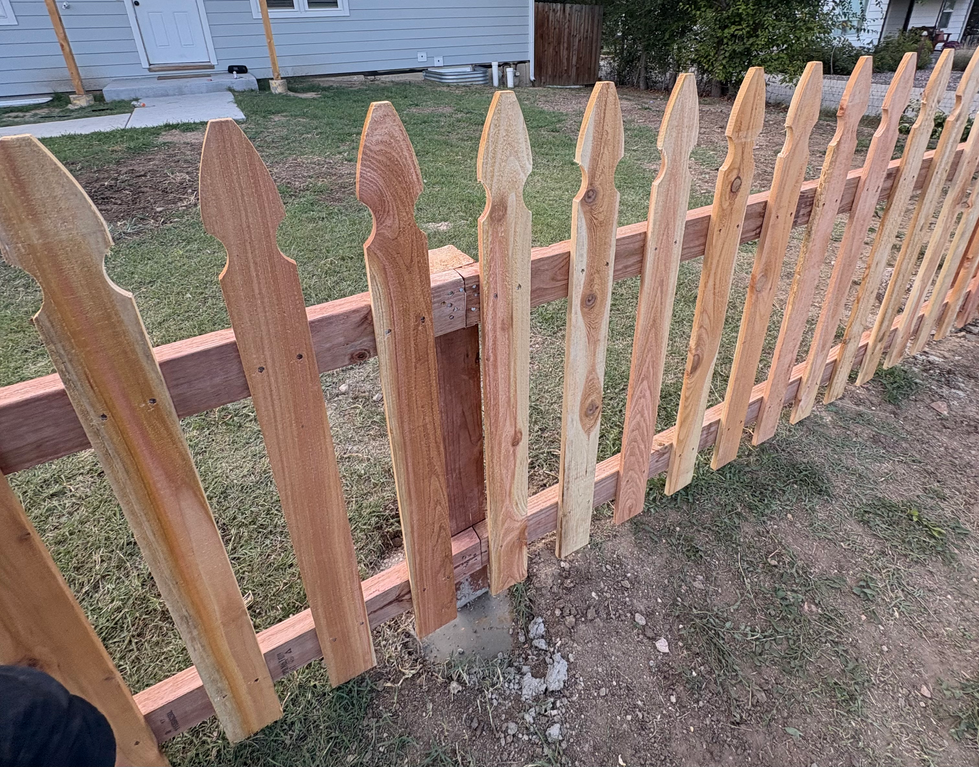 Pickets on new fence in Jefferson County, Colorado
