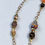 Thumbnail: African symbol and gemstone beads on a chain link choker