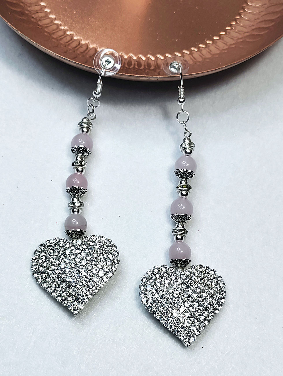 Thumbnail: Women's rose quartz earrings with silver accents and a rhinestone heart pendant