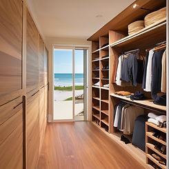 walk in closet with beuatifully crafted shelves an sliding glass doors that lead to a beac
