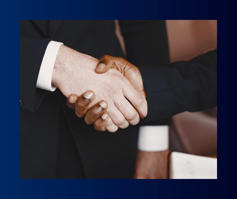 Diverse individuals shaking hands