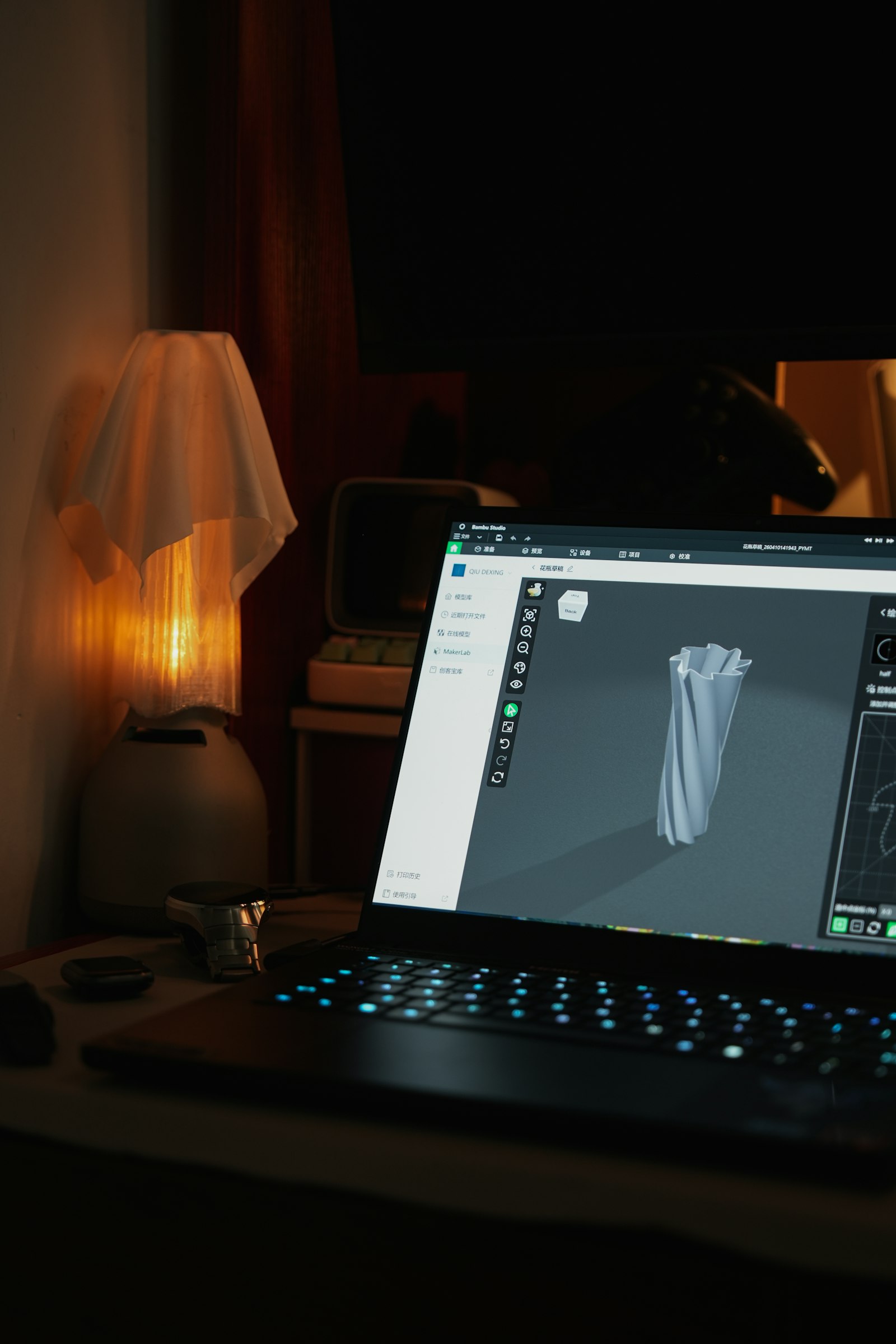 Laptop displaying a 3D model in a design workspace