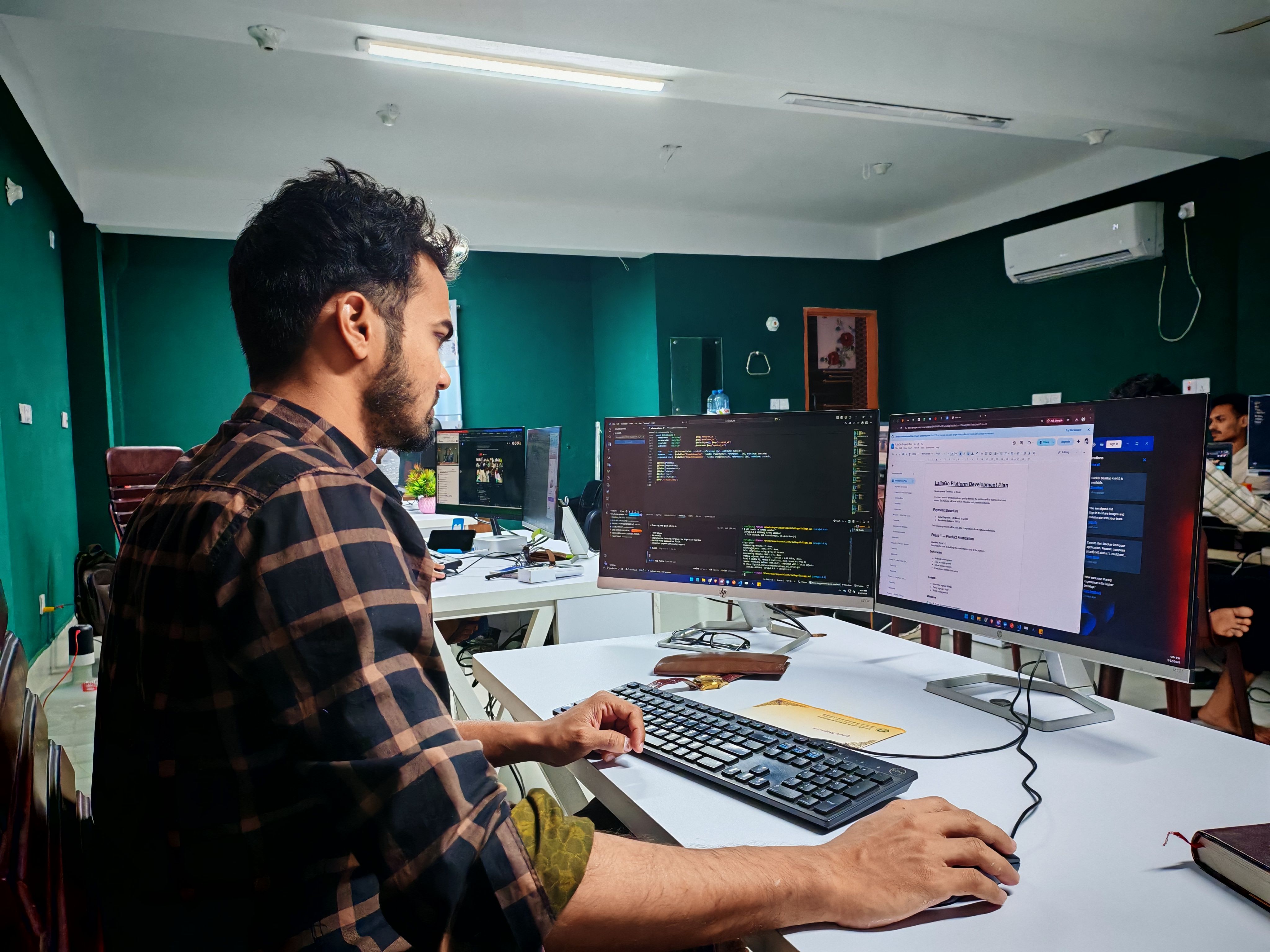 Developer building a digital environment with code and engine tools
