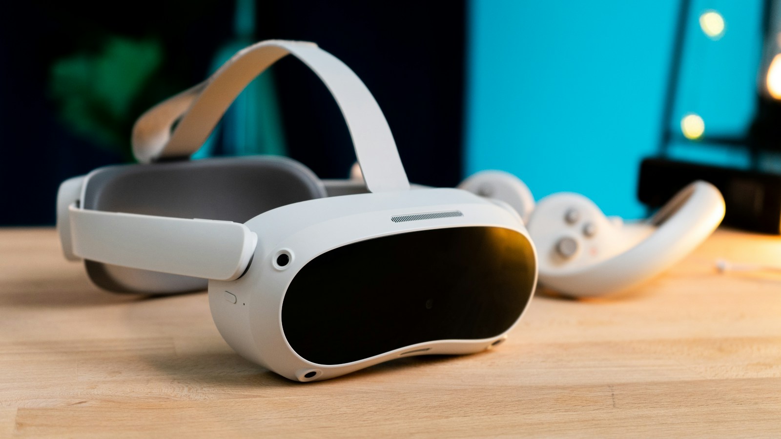 Pico VR headset and controllers on a wooden table