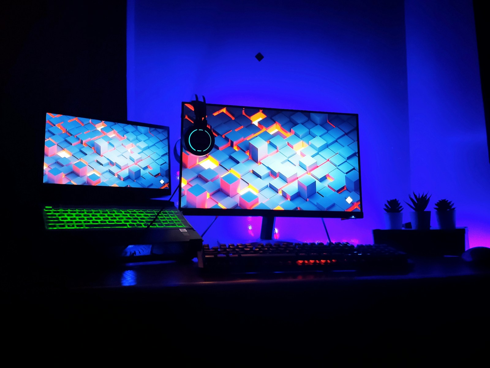 Game production team collaborating at computer workstations
