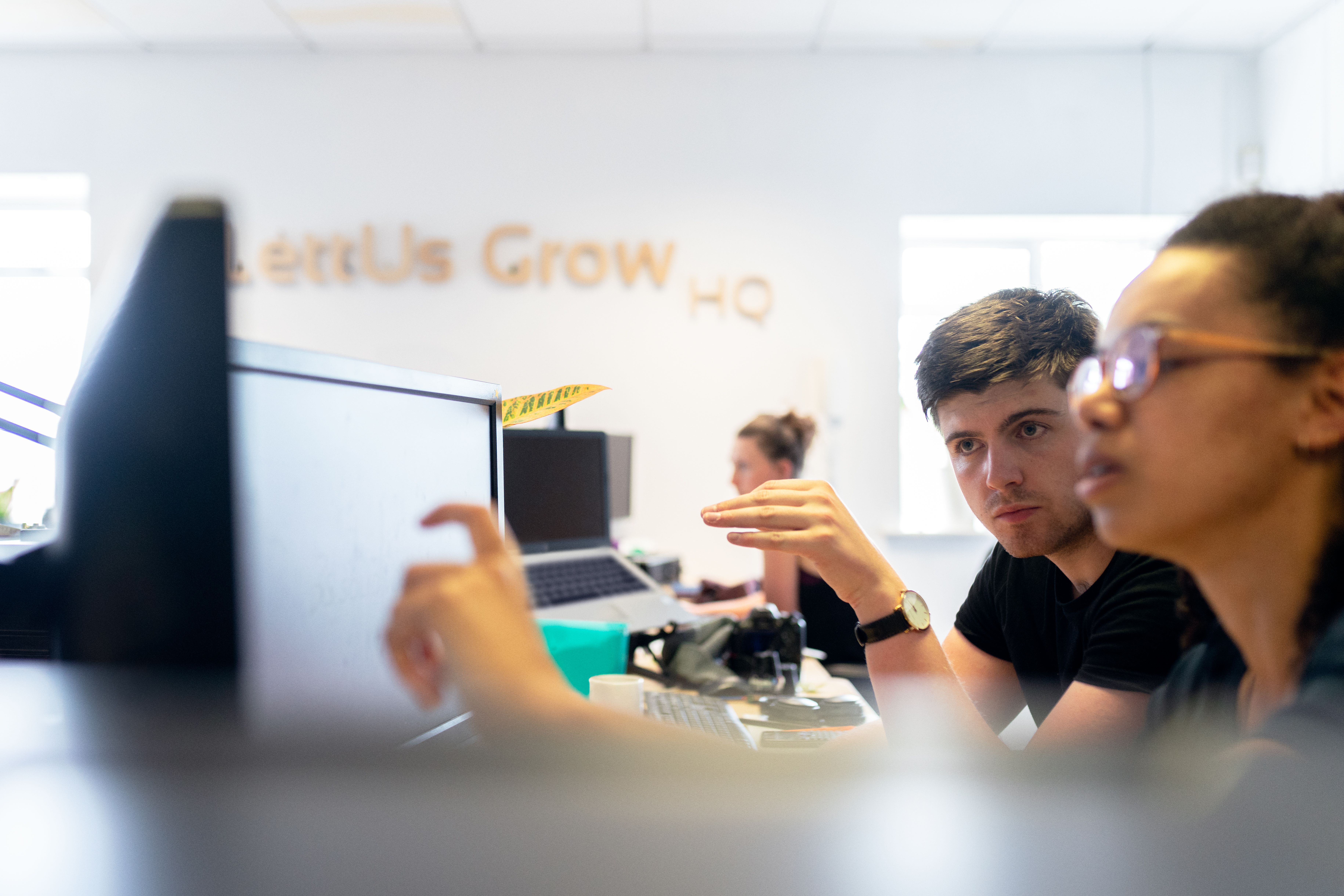 Engineers reviewing facial animation integration and performance on computer screens